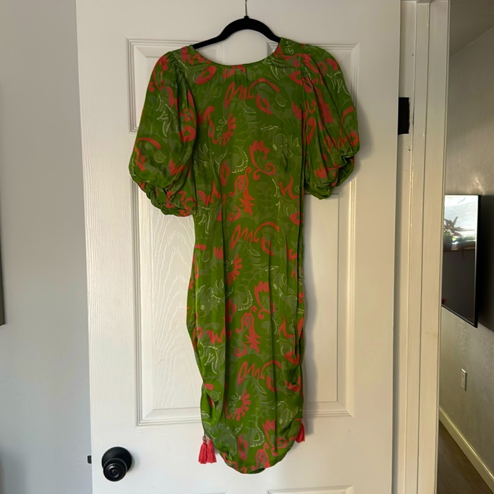 Cleo Bella dress with open back and puff sleeves.